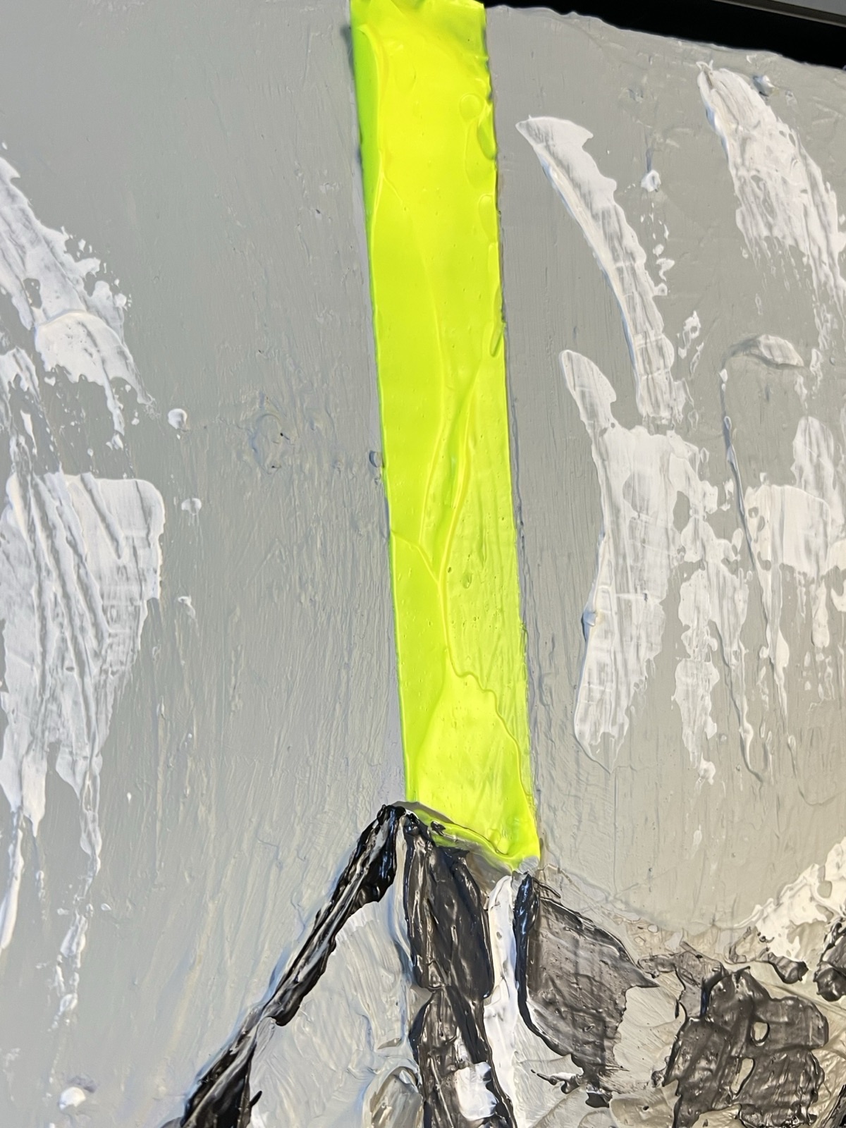 The fluorescent yellow beam falling down the mountain, laid on thick and glossy